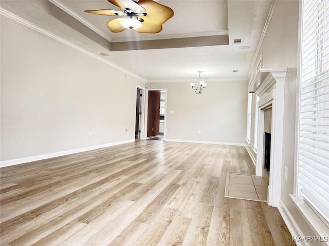 1312 Centerfield Ct, Montgomery, AL 36117 - spare room with a chandelier, light wood finished floors, ceiling fan, a fireplace with flush hearth, and ornamental molding
