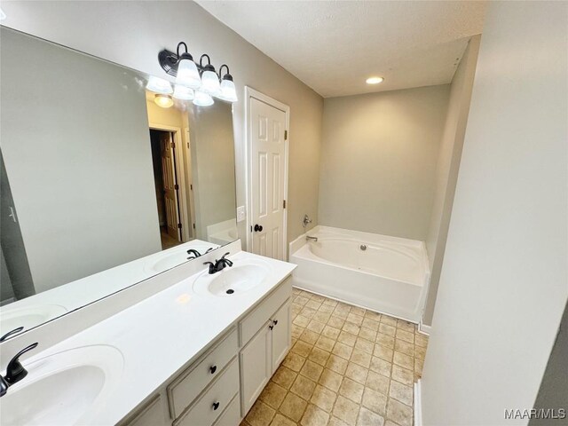 1312 Centerfield Ct, Montgomery, AL 36117 - full bathroom featuring a garden tub, double vanity, and recessed lighting
