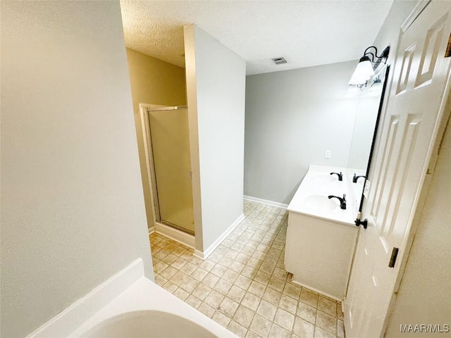 1312 Centerfield Ct, Montgomery, AL 36117 - full bath featuring a shower stall, a bath, tile patterned floors, and double vanity