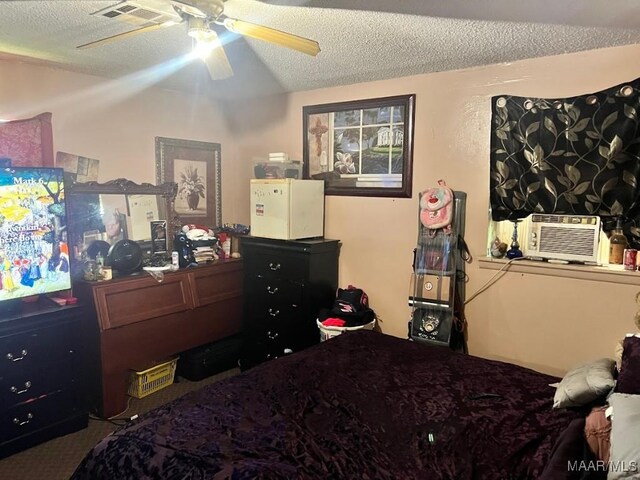 530 Brookview Dr, Montgomery, AL 36110 - bedroom featuring a textured ceiling, cooling unit, carpet floors, and ceiling fan