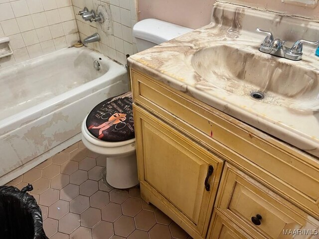 530 Brookview Dr, Montgomery, AL 36110 - bathroom featuring tile patterned flooring, vanity, and shower / washtub combination