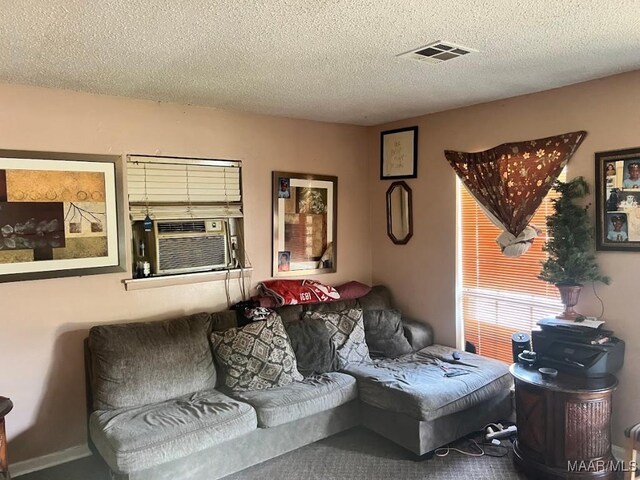 530 Brookview Dr, Montgomery, AL 36110 - living room featuring cooling unit and a textured ceiling
