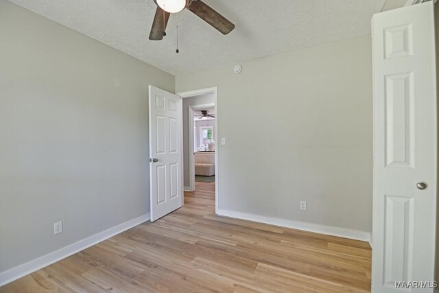 5010 Redland Rd, Wetumpka, AL 36093 - empty room with a ceiling fan, light wood-style flooring, and a textured ceiling
