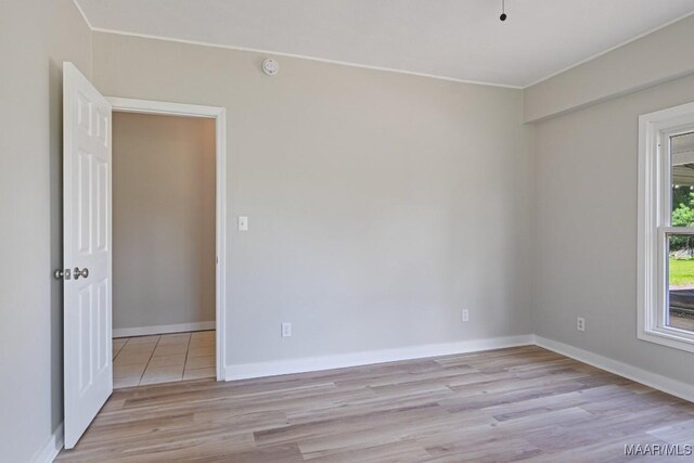 5010 Redland Rd, Wetumpka, AL 36093 - empty room featuring light wood-type flooring, a smoke detector, and ornamental molding