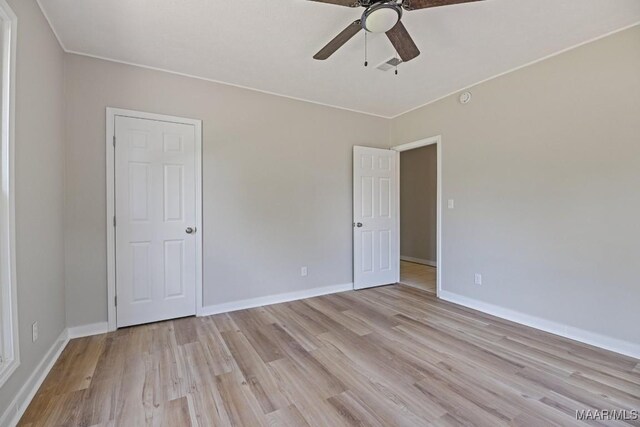 5010 Redland Rd, Wetumpka, AL 36093 - unfurnished bedroom featuring light wood-type flooring and a ceiling fan