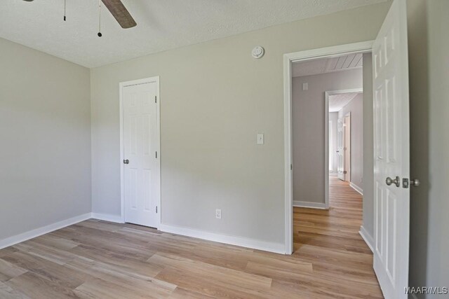 5010 Redland Rd, Wetumpka, AL 36093 - spare room featuring light wood-type flooring, ceiling fan, and a smoke detector