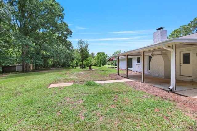5010 Redland Rd, Wetumpka, AL 36093 - view of grassy yard with a patio area and a ceiling fan