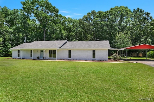 5010 Redland Rd, Wetumpka, AL 36093 - view of front of property with a front yard, a detached carport, driveway, and brick siding