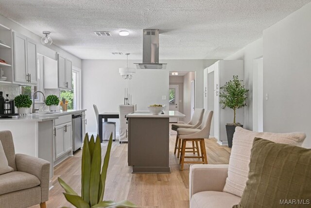 5010 Redland Rd, Wetumpka, AL 36093 - dining space with light wood-style flooring and a textured ceiling