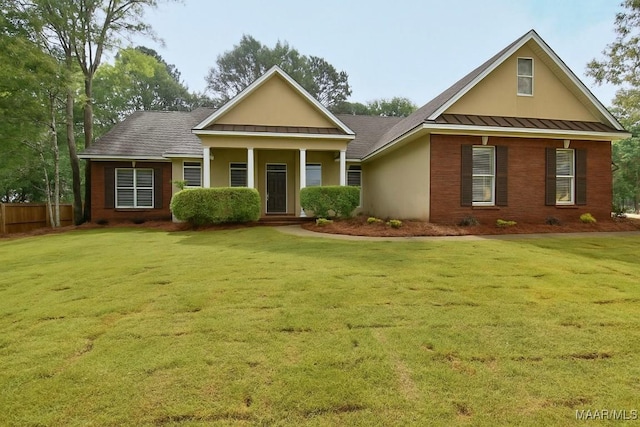 831 Windsong Loop, Wetumpka, AL 36093 - view of front of home featuring a standing seam roof, a metal roof, and stucco siding