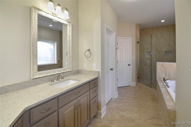 831 Windsong Loop, Wetumpka, AL 36093 - bathroom with vanity, a garden tub, and a stall shower