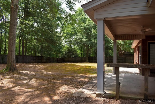 831 Windsong Loop, Wetumpka, AL 36093 - fenced backyard with ceiling fan and a patio area