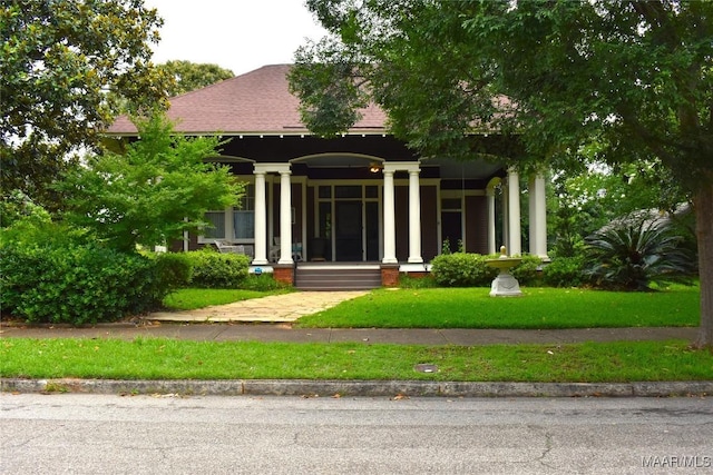 2207 Winona Ave, Montgomery, AL 36107 - entrance to property featuring a porch, roof with shingles, and a lawn