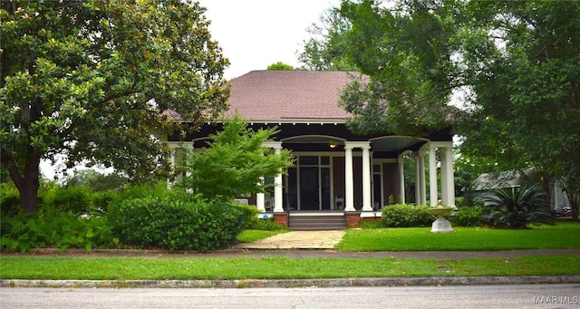 2207 Winona Ave, Montgomery, AL 36107 - obstructed view of property featuring a porch and roof with shingles