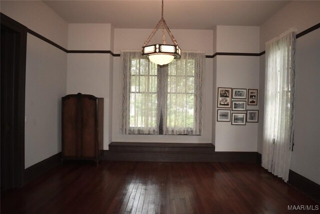 2207 Winona Ave, Montgomery, AL 36107 - unfurnished dining area featuring hardwood / wood-style floors and baseboards