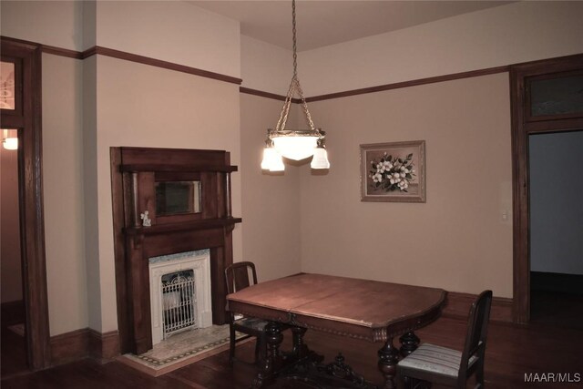 2207 Winona Ave, Montgomery, AL 36107 - dining area featuring wood finished floors and a fireplace