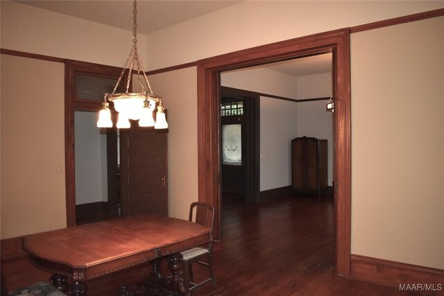 2207 Winona Ave, Montgomery, AL 36107 - dining space with dark wood finished floors and a chandelier