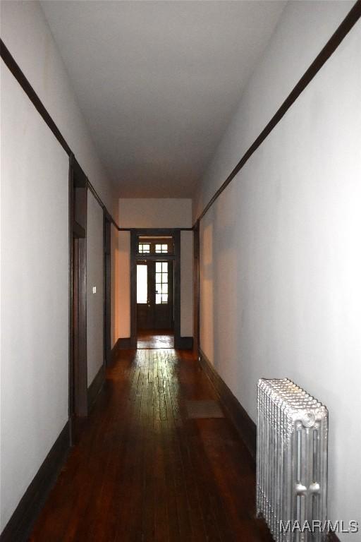 2207 Winona Ave, Montgomery, AL 36107 - hall with radiator and hardwood / wood-style flooring
