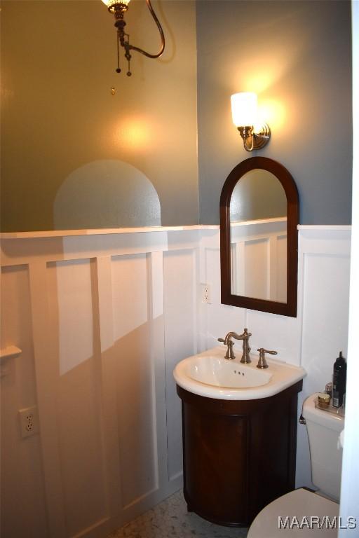2207 Winona Ave, Montgomery, AL 36107 - bathroom with a decorative wall, a wainscoted wall, and vanity