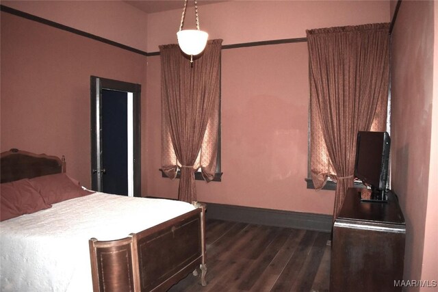 2207 Winona Ave, Montgomery, AL 36107 - bedroom featuring dark wood-type flooring and baseboards