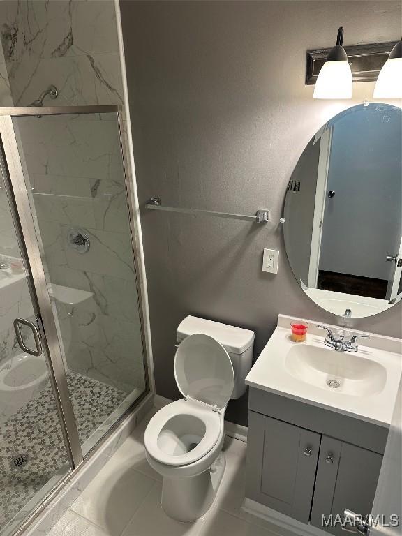 705 Mastin Lake Rd NW, Huntsville, AL 35811 - bathroom featuring vanity and a marble finish shower