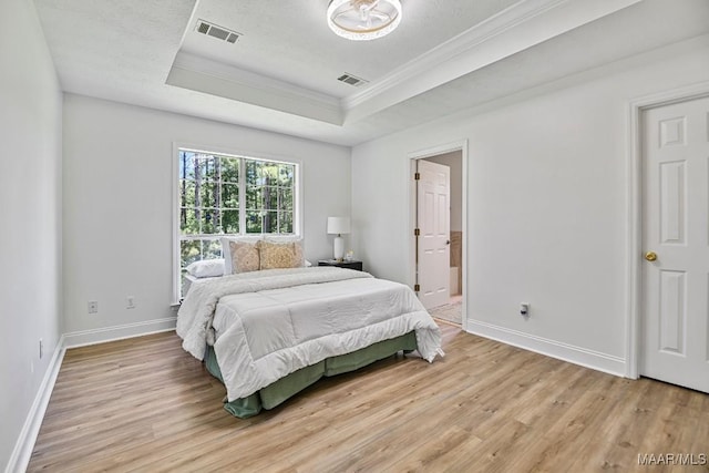 25 Sandy Springs Dr, Wetumpka, AL 36092 - bedroom featuring a tray ceiling, crown molding, light wood-style flooring, and ensuite bathroom