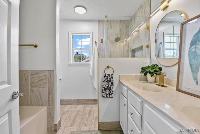 25 Sandy Springs Dr, Wetumpka, AL 36092 - bathroom with double vanity, plenty of natural light, a bath, and wood tiled floors