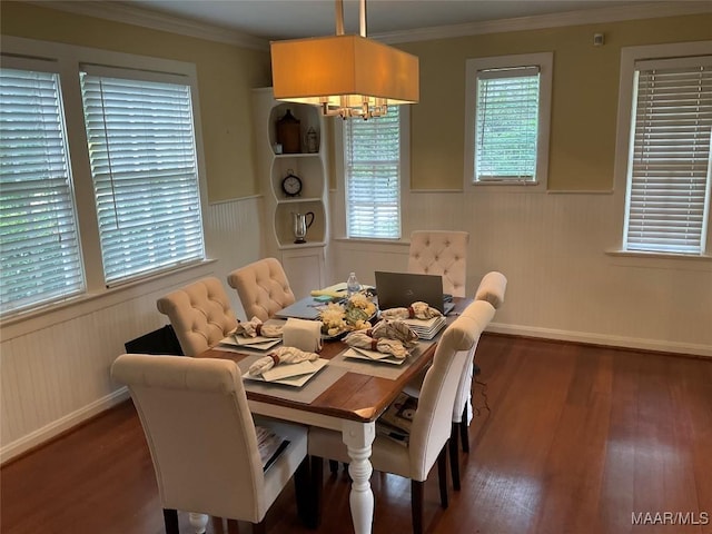 119 Mallory Dr, Selma, AL 36701 - dining space with a wainscoted wall, wood finished floors, a chandelier, and ornamental molding