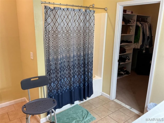 119 Mallory Dr, Selma, AL 36701 - bathroom with tile patterned flooring, shower / bath combo, and a spacious closet