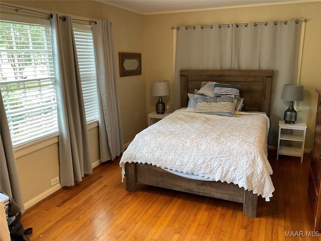 119 Mallory Dr, Selma, AL 36701 - bedroom featuring light wood-type flooring and crown molding