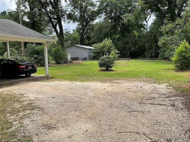 119 Mallory Dr, Selma, AL 36701 - view of green lawn with a carport