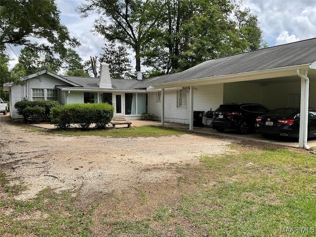 119 Mallory Dr, Selma, AL 36701 - ranch-style house with driveway, a chimney, and a carport