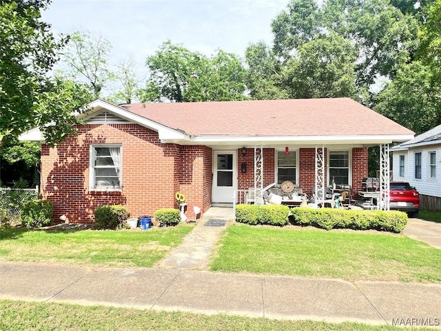 view of front of property with brick siding and covered porch