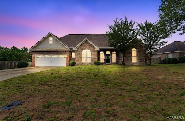 109 Inverness Rd, Wetumpka, AL 36092 - view of front facade featuring driveway, board and batten siding, an attached garage, stone siding, and brick siding