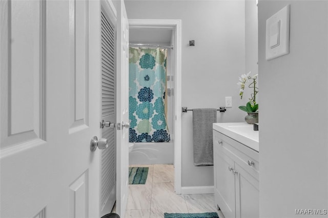 113 Duck Cv, Elmore, AL 36025 - bathroom featuring vanity, shower / bath combination with curtain, and marble finish floors