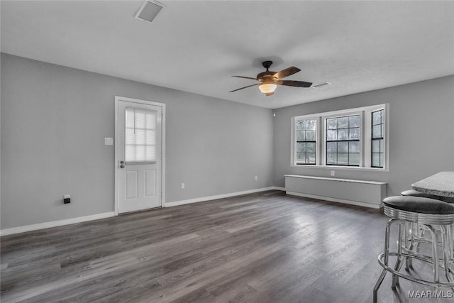 113 Duck Cv, Elmore, AL 36025 - unfurnished living room featuring a ceiling fan and dark wood finished floors