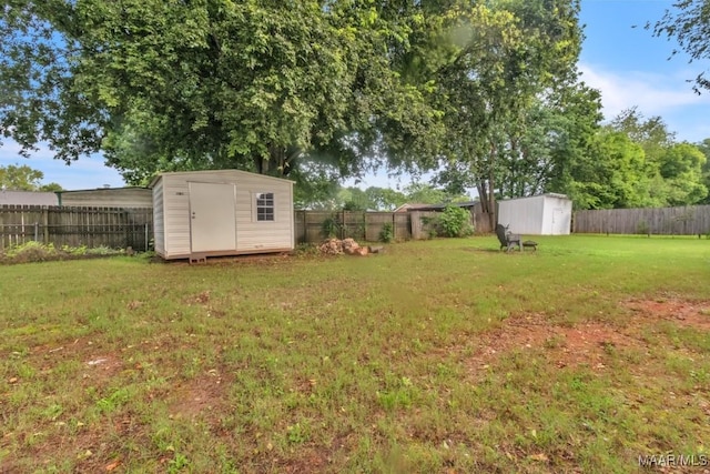 113 Duck Cv, Elmore, AL 36025 - fenced backyard featuring a shed