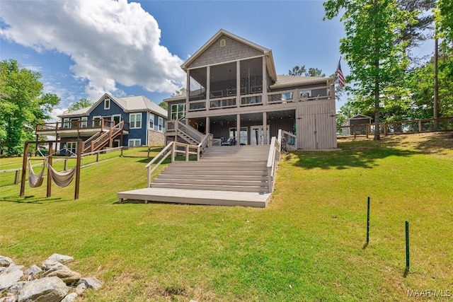 529 Hickory Dr, Wetumpka, AL 36092 - back of property featuring a sunroom, stairs, and a deck