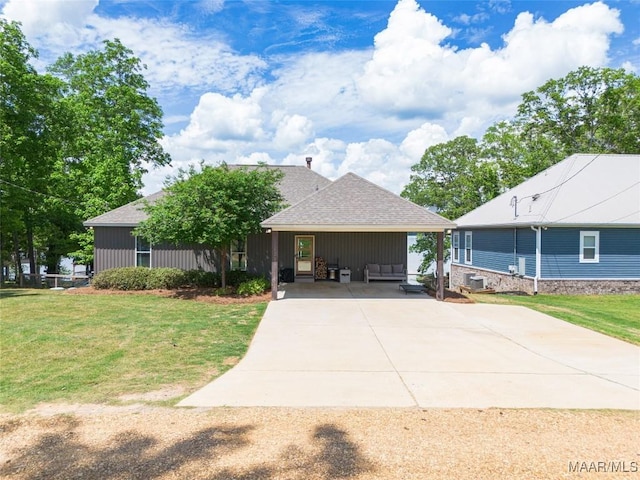 529 Hickory Dr, Wetumpka, AL 36092 - view of front of property with a front yard, concrete driveway, and roof with shingles