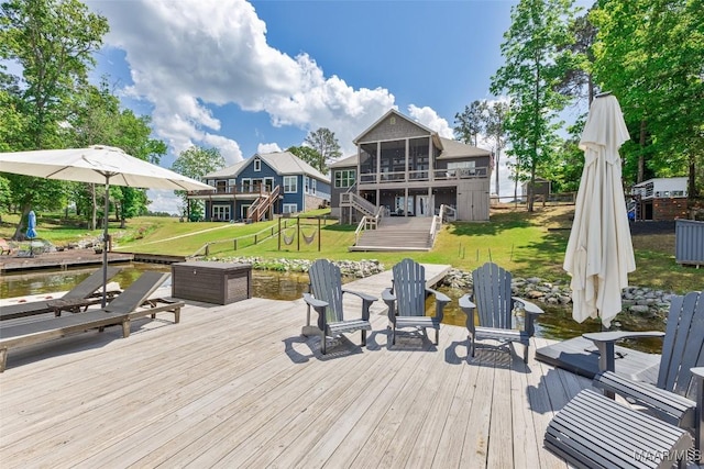 529 Hickory Dr, Wetumpka, AL 36092 - wooden terrace featuring stairway, a sunroom, a lawn, and a water view