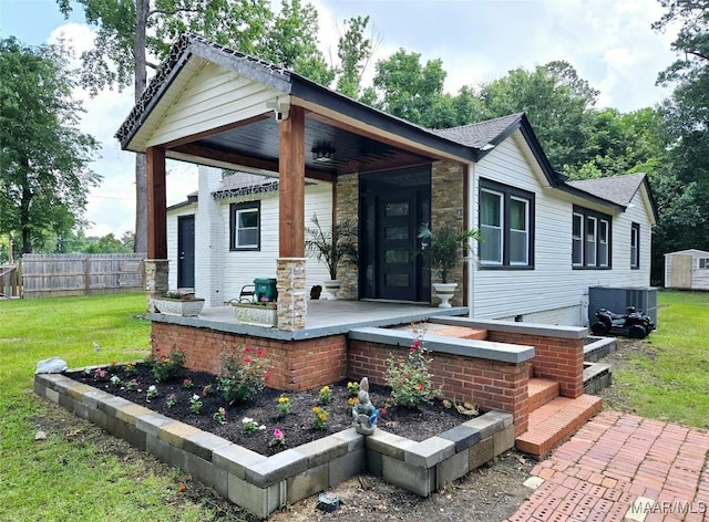 4760 Longview Rd, Elmore, AL 36025 - view of front of home featuring stone siding and a porch