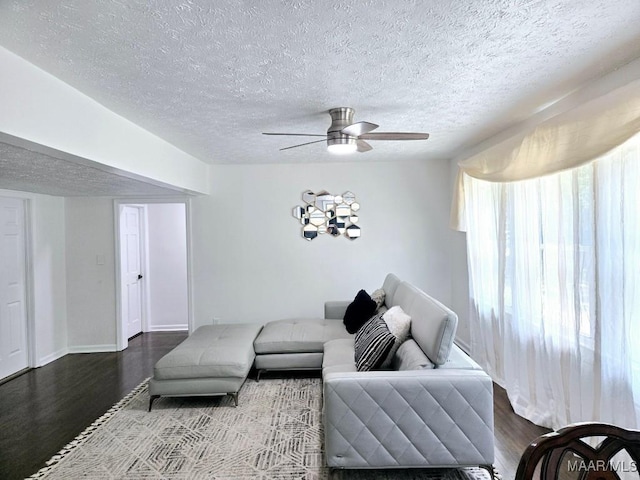 4760 Longview Rd, Elmore, AL 36025 - living area with wood finished floors, ceiling fan, and a textured ceiling