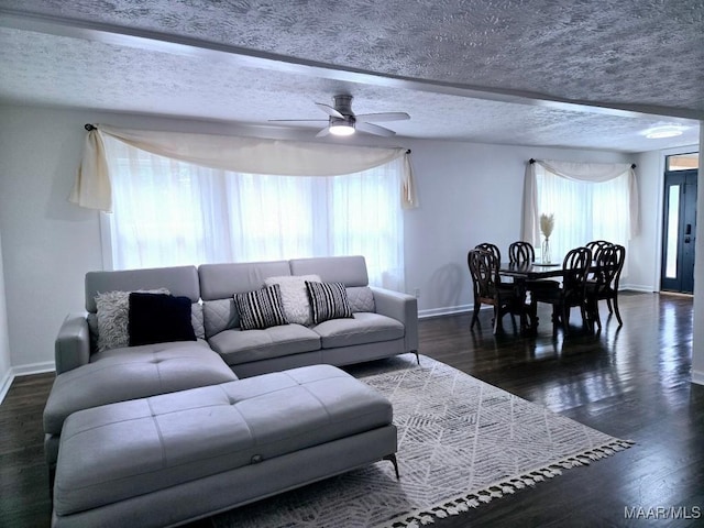 4760 Longview Rd, Elmore, AL 36025 - living room featuring a ceiling fan, wood finished floors, and a textured ceiling