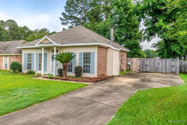 422 River Oaks Dr, Wetumpka, AL 36092 - view of front facade with brick siding, driveway, a gate, and a shingled roof