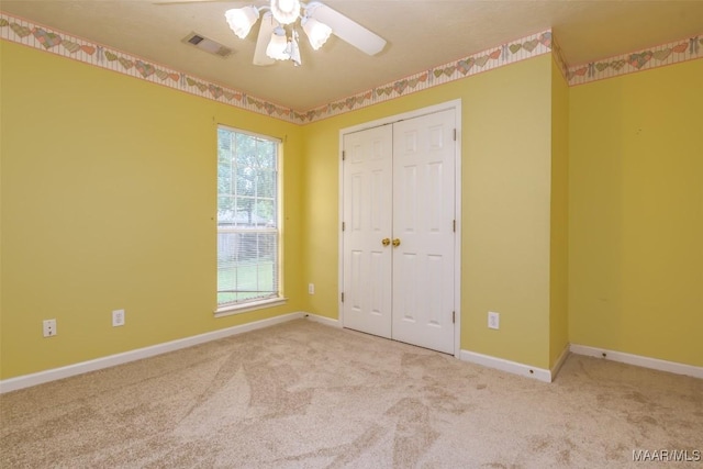 422 River Oaks Dr, Wetumpka, AL 36092 - unfurnished bedroom with carpet floors, a closet, and a ceiling fan