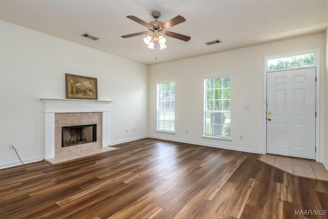 422 River Oaks Dr, Wetumpka, AL 36092 - unfurnished living room with wood finished floors, ceiling fan, and a tiled fireplace