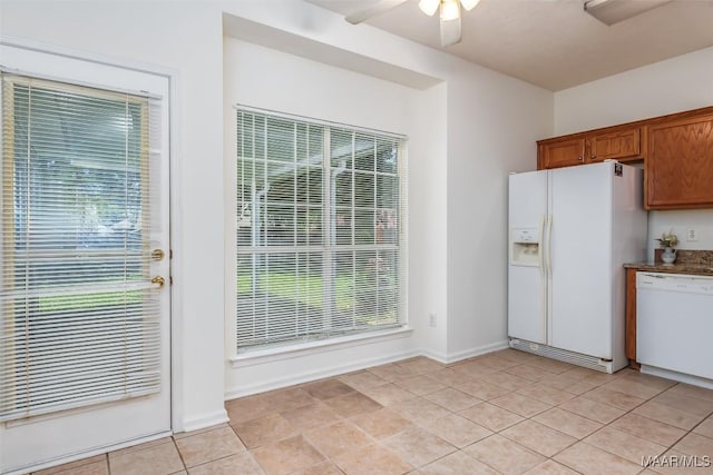 422 River Oaks Dr, Wetumpka, AL 36092 - kitchen featuring white appliances, ceiling fan, brown cabinets, and healthy amount of natural light