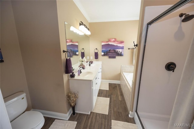 207 Pine Level Rdg, Deatsville, AL 36022 - bathroom with wood finished floors, crown molding, double vanity, a shower with door, and a garden tub