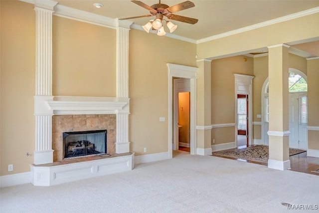 8330 Chadburn Way, Montgomery, AL 36116 - unfurnished living room featuring ceiling fan, ornamental molding, a tile fireplace, carpet flooring, and ornate columns