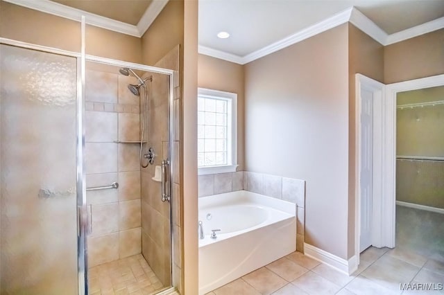 8330 Chadburn Way, Montgomery, AL 36116 - bathroom featuring a garden tub, a shower stall, tile patterned floors, a spacious closet, and ornamental molding